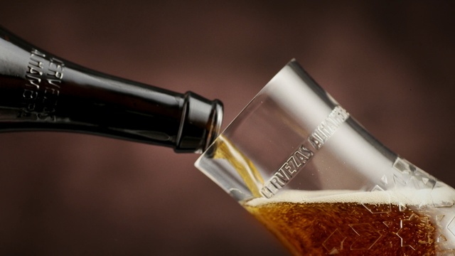 Video Reference: drink, alcoholic beverage, wine, liqueur, champagne, alcohol, bottle, glass bottle, distilled beverage, Person