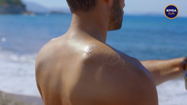Video Reference: Barechested, Chest, Arm, Male, Shoulder, Muscle, Skin, Neck, Joint, Back, Water, Outdoor, Person, Beach, Man, Ocean, Holding, Standing, Looking, Close, Front, Board, Sitting, Boat, Surfing, Body, Dog, Phone, White, Sign, Blue, Swimming, Human face, Swimsuit