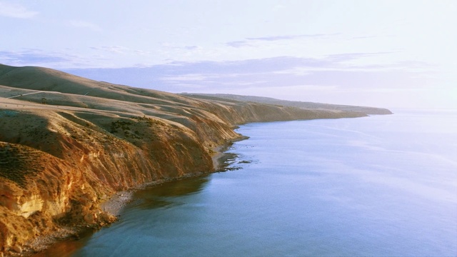 Video Reference: Body of water, Nature, Coast, Cliff, Sea, Headland, Natural landscape, Coastal and oceanic landforms, Sky, Shore