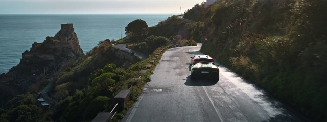 Video Reference: Vehicle, Mode of transport, Car, Road, Luxury vehicle, Asphalt, Coast, Terrain, Coastal and oceanic landforms, Supercar