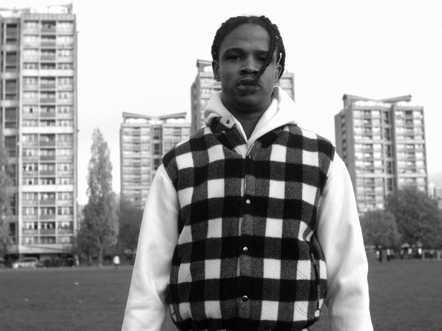 Video Reference: White, Plaid, Photograph, Black, Standing, Pattern, Black-and-white, Outerwear, Snapshot, Design