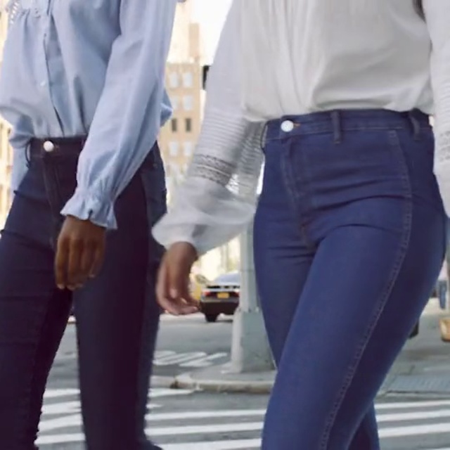 Video Reference: White, Clothing, Jeans, Waist, Standing, Leg, Footwear, Human leg, Gesture, Denim, Person