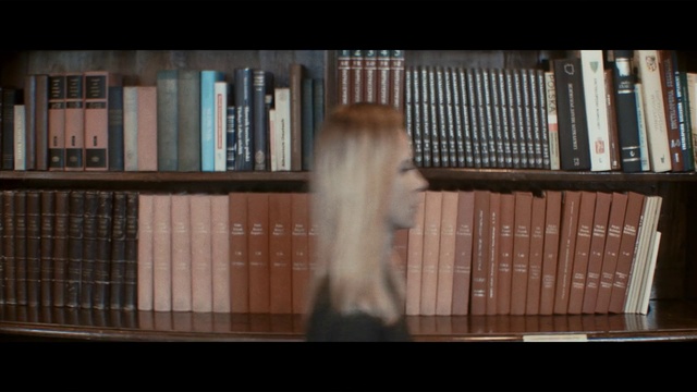 Video Reference: Snapshot, Window, Sitting, Book, Small, Library, Table, Front, Bookshelf, Bench, Brown, Cat, White, Dog, Man, Room, Bear, Shelf, Text, Bookcase, Human face, Cosmetic