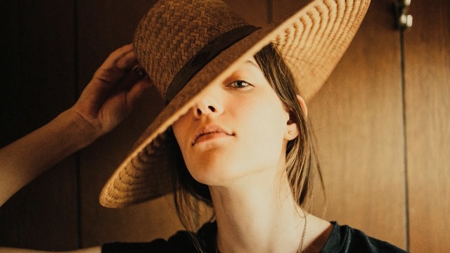Video Reference: cowboy hat, hat, headdress, clothing, sombrero, portrait, consumer goods, covering, face, person, fashion, model, smile, pretty, eyes, attractive, adult, hair, people