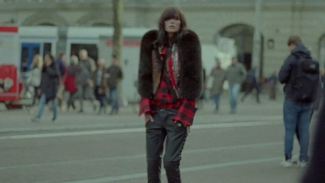 Video Reference: fur coat, coat, skate, garment, clothing, adult, Person