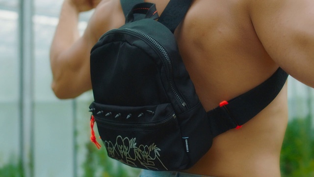 Video Reference: Shoulder, Arm, Joint, Male, Abdomen, Muscle, Chest, Waist, Human body, Elbow, Person, Cellphone, Phone, Holding, Wearing, Sitting, Front, Woman, Hand, Young, Man, Standing, Talking, Table, Baseball, White, Red, Blue, Fashion accessory, Underpants