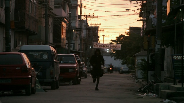 Video Reference: Mode of transport, Neighbourhood, Street, Town, Lane, Road, Downtown, Pedestrian, Vehicle, Urban area, Person