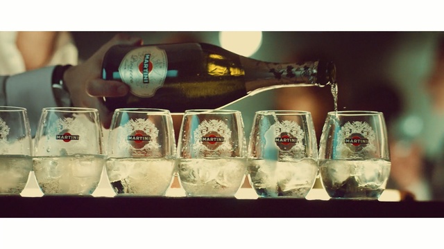 Video Reference: liqueur, drink, alcoholic beverage, distilled beverage, alcohol, wine glass, stemware, glass bottle, glass, drinkware, Person