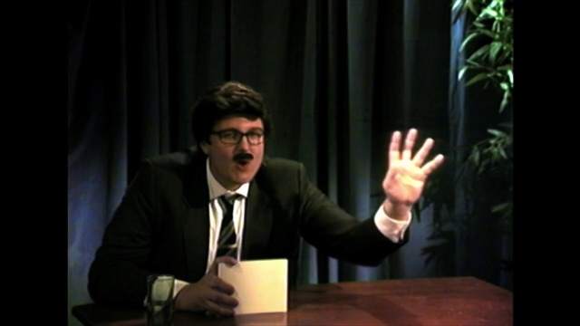 Video Reference: Public speaking, Speech, Suit, Gentleman, Male, Conversation, Fun, Formal wear, Interaction, Event, Person