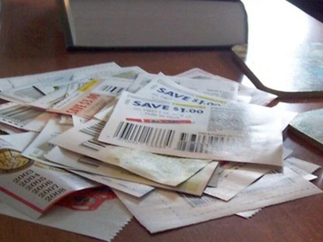 Video Reference: coupons, flyers, discount, sale, paper, stack, table, barcodes, promotions, shopping, retail, clutter, documents