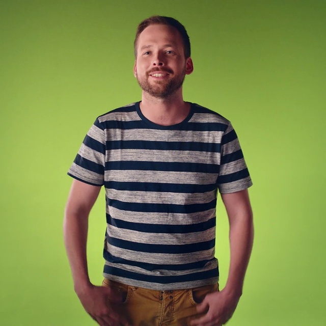 Video Reference: T-shirt, Clothing, Cool, Sleeve, Shoulder, Standing, Male, Neck, Top, Arm, Person, Striped, Man, Shirt, Holding, Woman, Young, Cake, Table, Green, Wearing, Yellow, Zebra, Luggage, White, Human face, Smile