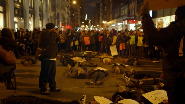 Video Reference: night, crowd, event, demonstration, riot, protest, street, city, Person