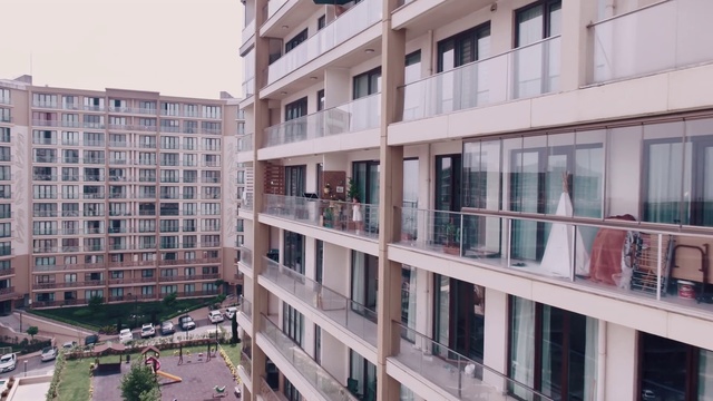 Video Reference: Building, Property, Architecture, Urban area, Apartment, Condominium, Residential area, Metropolitan area, Mixed-use, Human settlement