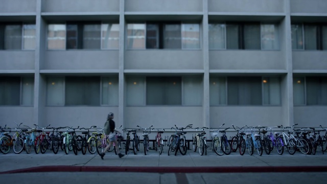 Video Reference: Text, Architecture, Facade, Bicycle, Urban area, Building, Vehicle, Window, Art, City