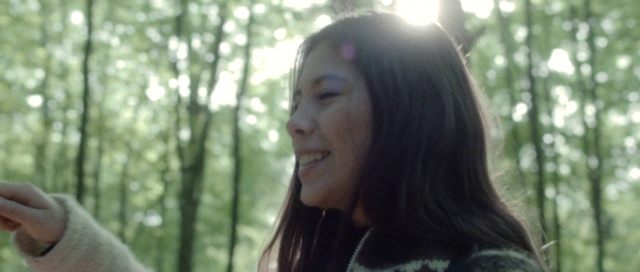 Video Reference: Hair, Face, Facial expression, Black hair, Hairstyle, Beauty, Lip, Nose, Long hair, Natural environment