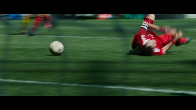 Video Reference: Player, Sports, Football, Sports equipment, Football player, Team sport, Ball game, Sport venue, Ball, Tournament, Person, Soccer, Grass, Field, Playing, Game, Man, Uniform, Baseball, Group, Red, Young, People, Sport, Image