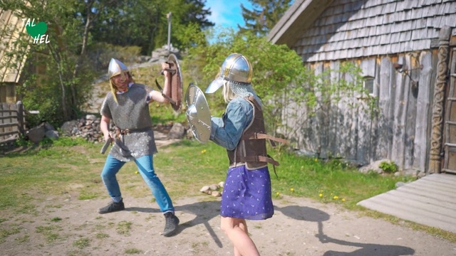 Video Reference: Tree, Landscape, Middle ages, Outdoor, Grass, Person, Building, Little, Child, Holding, Playing, Young, Small, Park, Boy, Walking, Girl, Ball, Riding, Standing, Yard, Man, Street, Woman, Frisbee, Throwing, People, Field, Kite, Court, Group, Board, Flying, Zoo, Ground, Clothing, Footwear