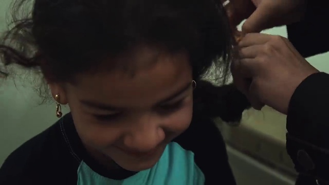 Video Reference: Hair, Face, Forehead, Hairstyle, Nose, Black hair, Ear, Cheek, Head, Eyebrow