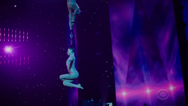 Video Reference: Performance, Entertainment, Performing arts, Acrobatics, Performance art, Event, Public event, Purple, Circus, Aerialist