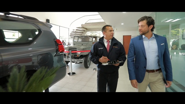 Video Reference: car, land vehicle, motor vehicle, vehicle, mode of transport, automotive design, luxury vehicle, family car, technology, auto show, Person