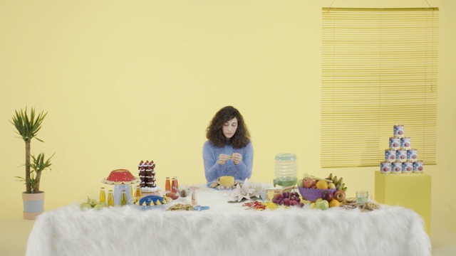 Video Reference: yellow, table, interior design, Person