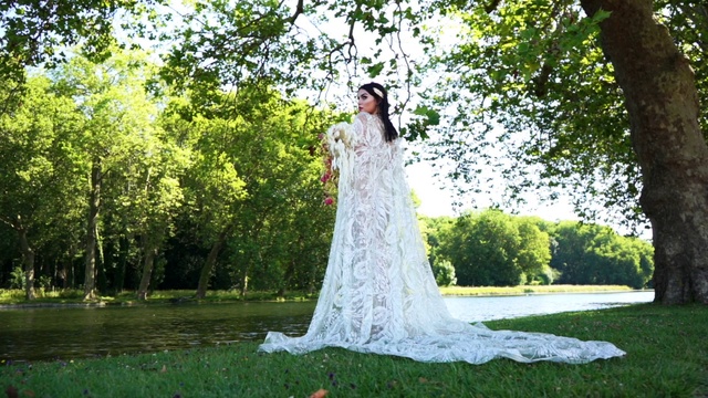 Video Reference: Bride, Gown, Wedding dress, Dress, Veil, Photograph, Clothing, Bridal clothing, Bridal accessory, Bridal veil