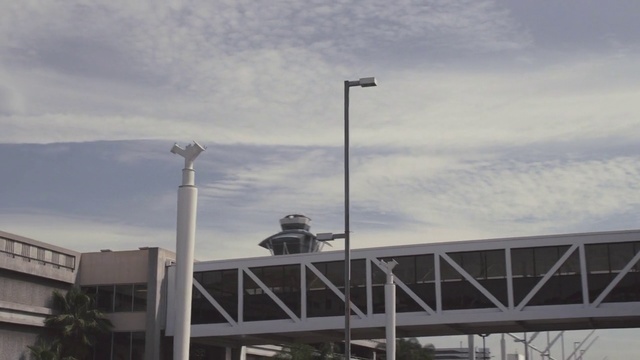 Video Reference: Sky, Street light, Lighting, Light fixture, Architecture, Infrastructure, Tree, Cloud, Building, Tower