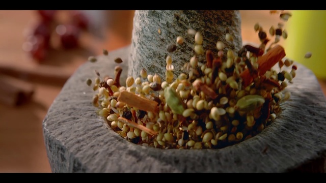 Video Reference: Food, Plant, Cuisine, Houseplant, Person, Cake, Indoor, Table, Piece, Slice, Cutting, Wooden, Decorated, Chocolate, Sitting, Plate, Topped, Board, Paper, Small, Cut, Covered, Close, Dessert, Made, Sliced, Half, Toppings, Banana, Birthday, Fruit, Knife, White, Cheese, Pizza, Square