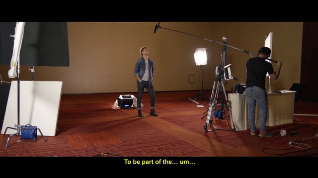 Video Reference: Music, Microphone, Studio, Performance, Indoor, Man, Room, Holding, Table, Playing, Living, Standing, Woman, Video, Player, Game, Court, Wooden, People, Desk, Young, Group, Computer, Wii, Ball, Floor, Person, Tripod, Text, Clothing, Footwear