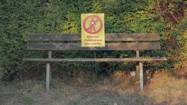 Video Reference: Nature reserve, Sign, Signage, State park, Land lot, Bench, Furniture, Grass, Landscape, Table