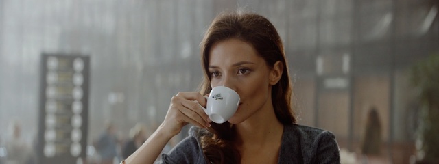 Video Reference: Skin, Cup, Drinking, Coffee cup, Mouth, Brown hair, Drinkware, Neck, Dairy, Tableware, Person