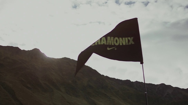 Video Reference: Flag, Sky, Mountain, Hill, Signage, Sign, Landscape, Mountain range, Wind