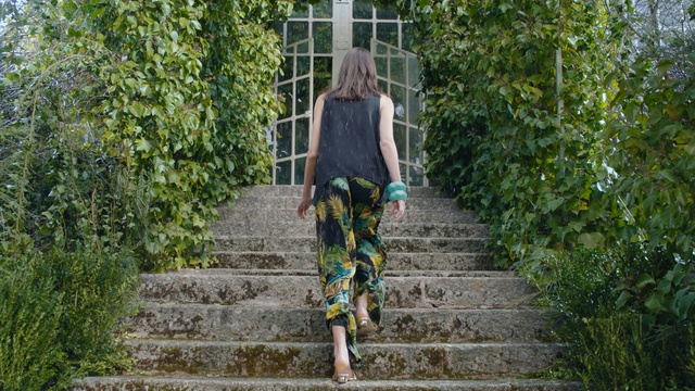 Video Reference: Fashion, Outerwear, Street fashion, Grass, Tree, Footwear, Dress, Plant, Photography, Vehicle