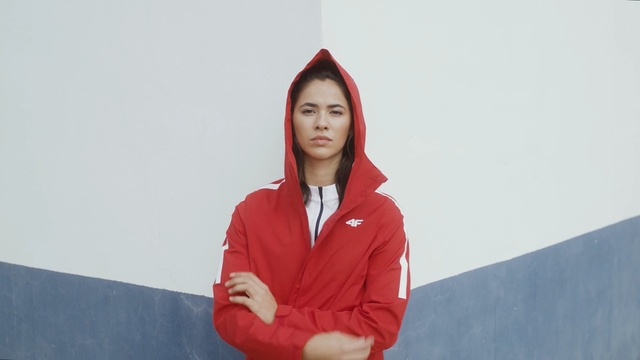 Video Reference: Red, Outerwear, Sitting, Shoulder, Hoodie, Neck, Smile, Person