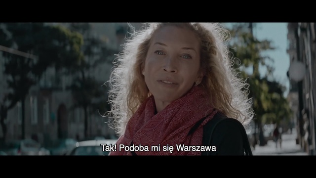 Video Reference: Face, Photograph, Facial expression, Nose, Lady, Head, Human, Snapshot, Photo caption, Adaptation, Person, Outdoor, Looking, Woman, Holding, Front, Standing, Wearing, Cellphone, Screen, Phone, Girl, Red, Using, Smiling, Young, Man, White, Street, Shirt, City, Human face, Screenshot, Portrait, Smile, Clothing