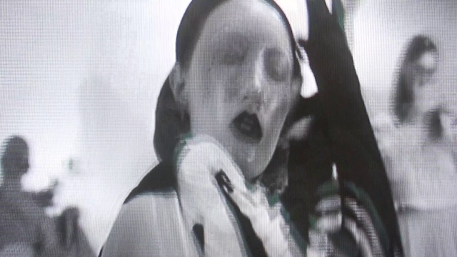 Video Reference: Sunglasses, Gesture, Grey, Black-and-white, Eyewear, Audio equipment, Monochrome photography, Pattern, Font, Monochrome