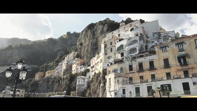 Video Reference: town, sky, city, terrain, building, geological phenomenon, mountain, village, mountain range, facade