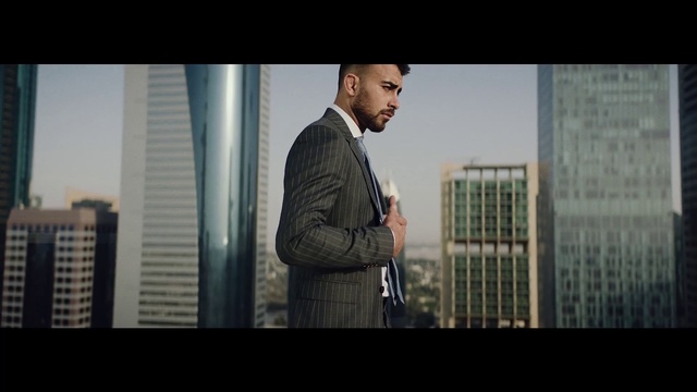 Video Reference: Suit, Photograph, Clothing, Standing, Formal wear, White-collar worker, Snapshot, Outerwear, Human, Jacket