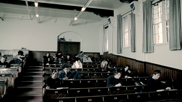 Video Reference: auditorium, performing arts center, conference hall, audience, musical instrument accessory, Person