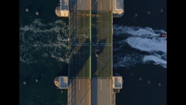 Video Reference: Space, Vehicle, Snow, Outdoor, Train, Dark, Covered, Sitting, Door, Yellow, Street, Night, Bus, Stop, Red, Riding, Double, Track, Standing, Board, Sign, Refrigerator, White, Traffic, Man, Water, Ship, Text