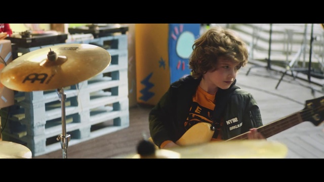 Video Reference: Musical instrument, Acoustic guitar, Plucked string instruments, Musician, Guitar, String instrument, Music, Drum, Guitarist, Drums, Person, Indoor, Table, Window, Young, Man, Baseball, Cake, Uniform, Little, Sitting, Cutting, Boy, Board, Computer, Plate, Bat, Wearing, Holding, Laptop, Pizza, Woman, Standing, Kitchen, Cut, Playing, Ball, Room, White, Video, Brass, Human face, Text, Screenshot, Clothing