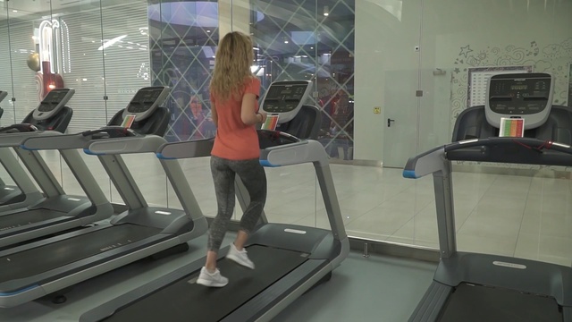 Video Reference: Treadmill, Exercise machine, Exercise equipment, Standing, Shoulder, Leisure centre, Leg, Room, Physical fitness, Sports equipment