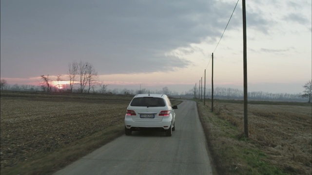 Video Reference: Land vehicle, Vehicle, Car, Road, Mode of transport, Transport, Mid-size car, Lane, Road surface, Asphalt