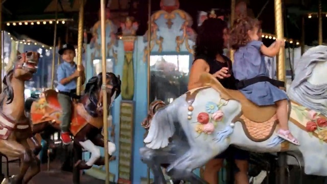 Video Reference: Carousel, Amusement ride, Amusement park, Park, Recreation, Fun, Nonbuilding structure, Event, Horse, Person