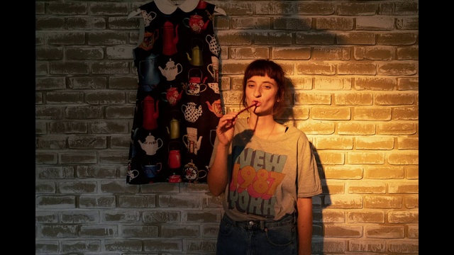 Video Reference: Clothing, Flash photography, Temple, Orange, Street fashion, T-shirt, Happy, Brick, Waist, Brickwork
