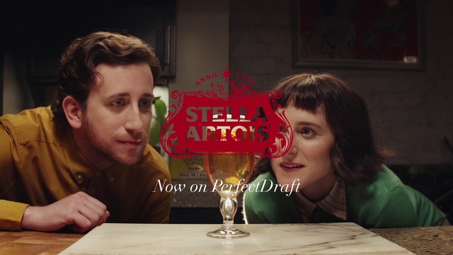 Video Reference: Hair, Face, Head, Hairstyle, Mouth, Table, Smile, Drinkware, Stemware, Fun