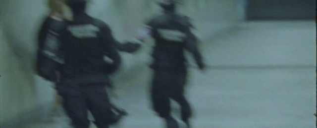 Video Reference: Gesture, Art, Event, Electric blue, Darkness, Shadow, Personal protective equipment, Visual arts, Font, Fictional character