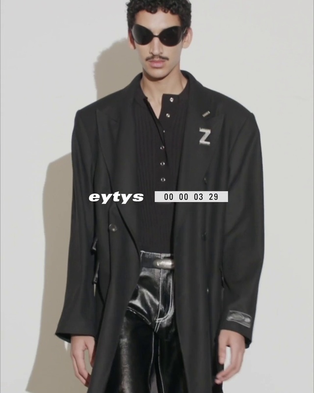 Video Reference: Face, Outerwear, Shoe, White, Vision care, Black, Street fashion, Neck, Sleeve, Waist