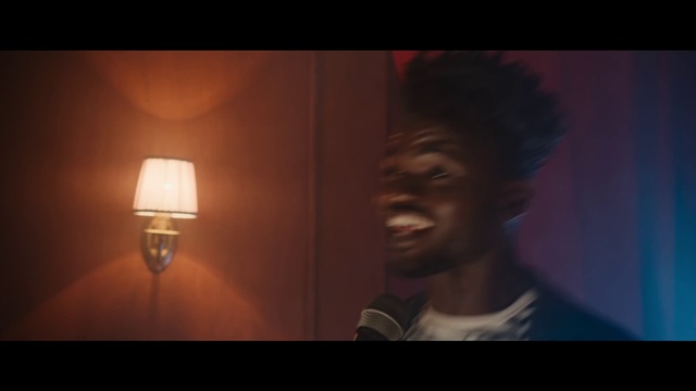Video Reference: Head, Flash photography, Jaw, Lamp, Smile, Facial hair, Tints and shades, Sconce, Lantern, Wood
