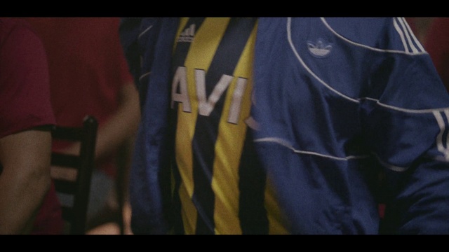 Video Reference: Jersey, Sleeve, Gesture, Flag, Sportswear, Font, Tints and shades, Electric blue, T-shirt, Pattern